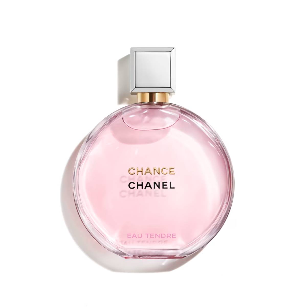 A round, pink Chanel Chance perfume bottle on a white background.